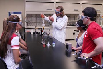 Organic chemistry faculty with students in the lab